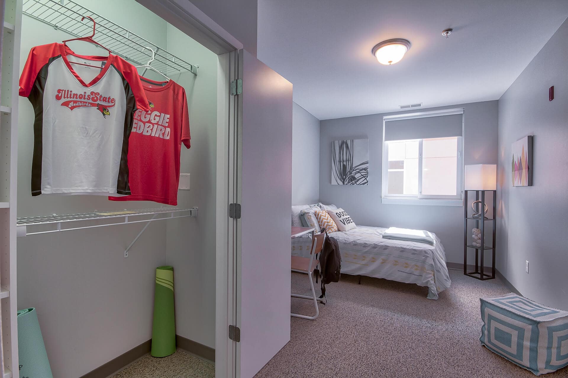 bedroom with an attached closet at the flats at isu apartments in normal il